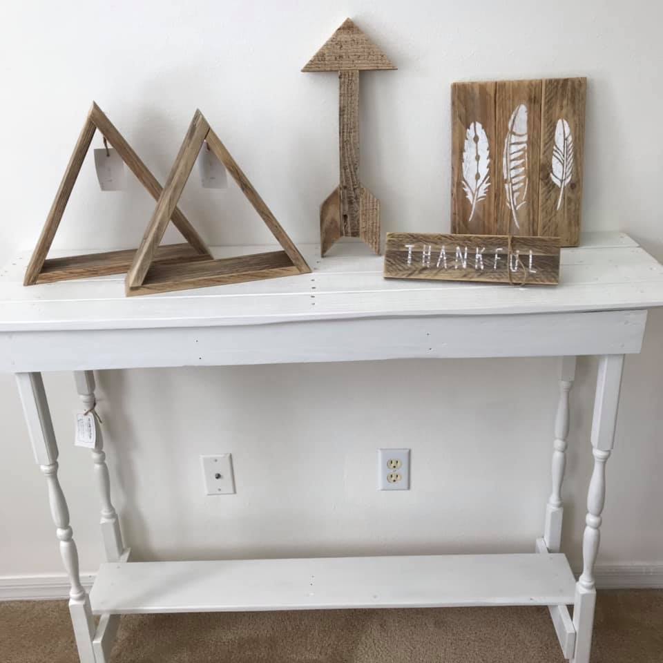 side table showing triangle, arrow and sign